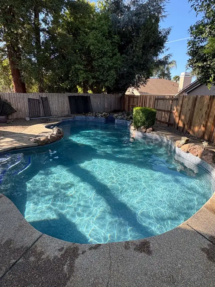 Sparkling clear swimming pool after weekly pool service in Roseville, CA