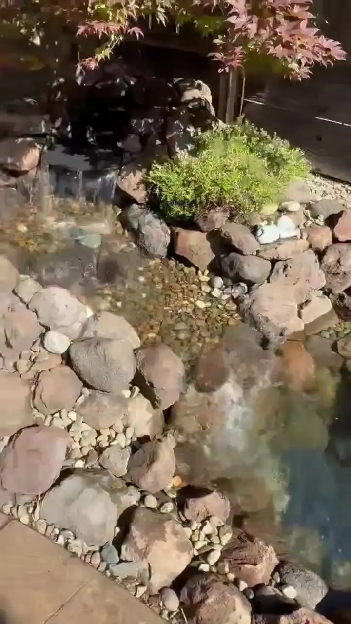 Stream and stone waterfall running clear after service